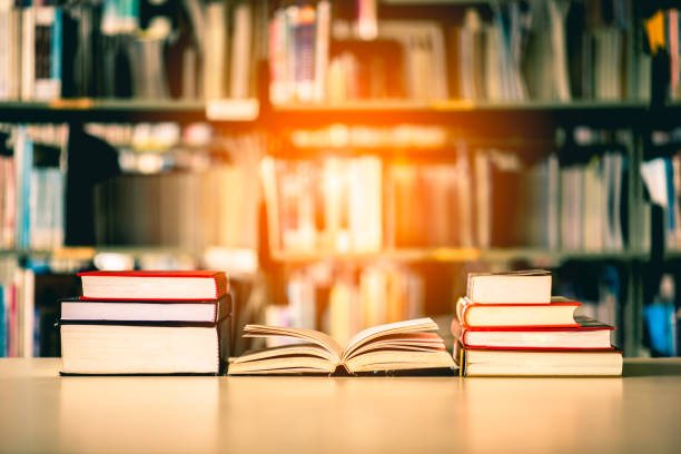 istock Book stack is placed on the library desk. education background, back to school concept. 1139496748