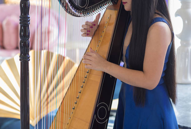 istock female fingers playing the harp 1139496847
