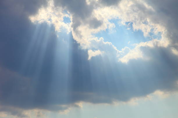 istock Ray of sun light shine through the gap among cloud with blue sky 1139498967