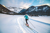 Cross-country skiier gliding on the slopes