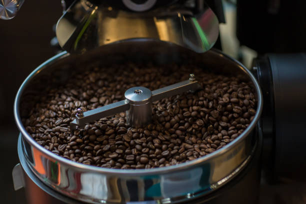 istock Freshly roasted aromatic coffee beans in a modern coffee roasting machine. Fresh Coffee Beans - Freshly roasted spinning cooler professional machine. 1139504183