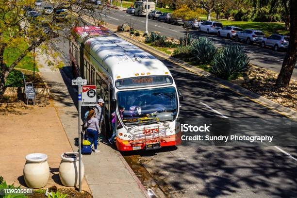 People Getting On A Bus At Balboa Park Stop San Diego Stock Photo - Download Image Now