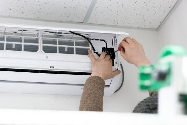 istock air conditioner installing. technician comunicate power line cable to new device. 1139506789