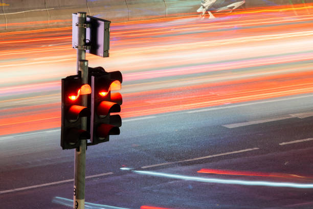 istock Traffic light with long exposure night in Bangkok, Thailand. 1139510709