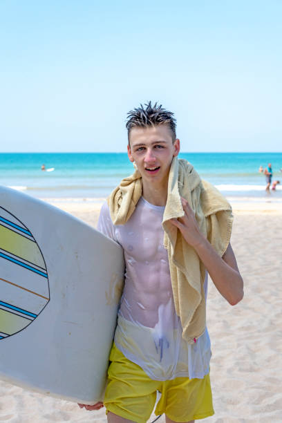 Close up of a boy on a floatation device in the ocean