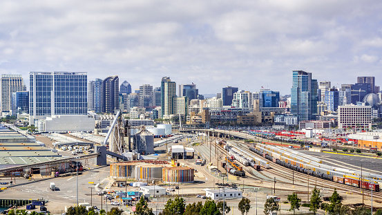 March 19, 2019 San Diego / CA / USA - Aerial view of an industrial area near the Port of San Diego; the city's skyline visible in the background