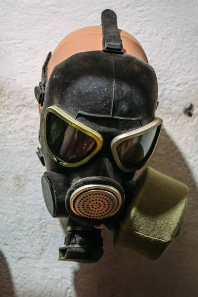 istock Vintage Soviet Gas Mask on white wall in bomb shelter 1139514349