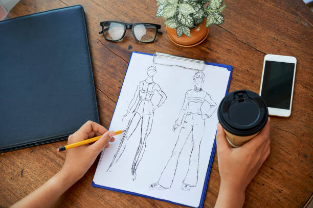 istock Designer drawing fashion sketch 1139515673