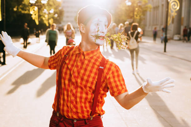 Mime on the street waiting to meet with his lover Clown on the street waiting to meet with his lover mime artist stock pictures, royalty-free photos & images