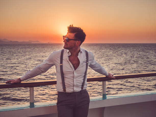 istock Attractive man in white shirt on deck 1139524417