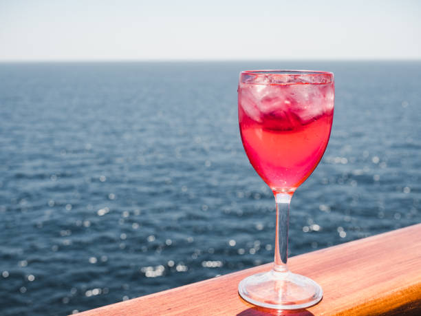 istock Wineglass with a pink cocktail and ice cubes 1139524560
