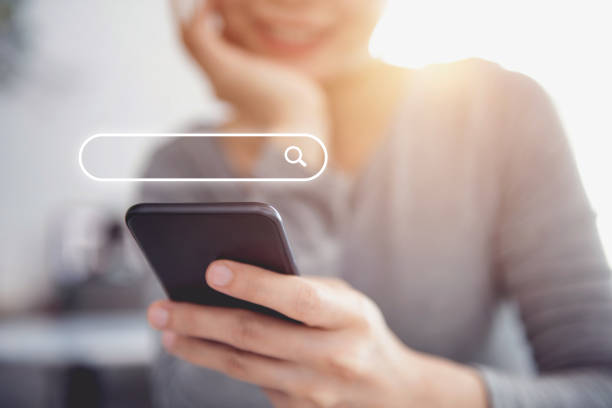 Closeup woman hands using mobile phone with Searching Browsing Internet Data Information Networking Concept.