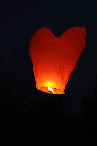 istock Red heart-shaped chinese lantern in the  sky 1139527649