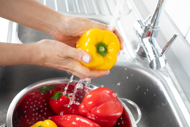 istock Washing Peppers Under Running Water 1139527829