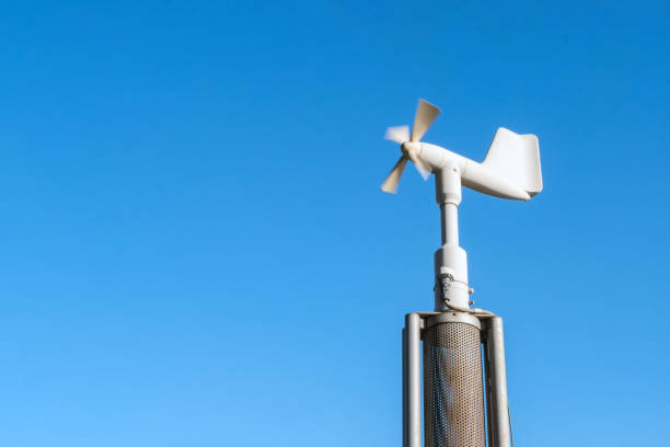 istock Smart agriculture and smart farm technology concept. Revolving vane anemometer, a meteorological instrument used to measure the wind speed and solar cell system with blue sky background. 1139528844