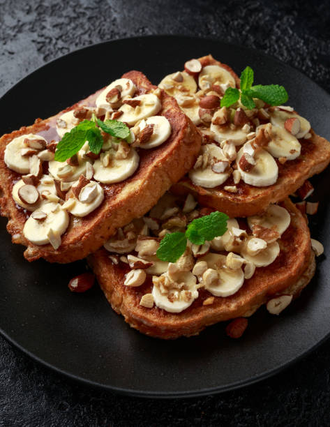 istock French cinnamon toast with banana, nuts and hazelnut, honey. 1139529040