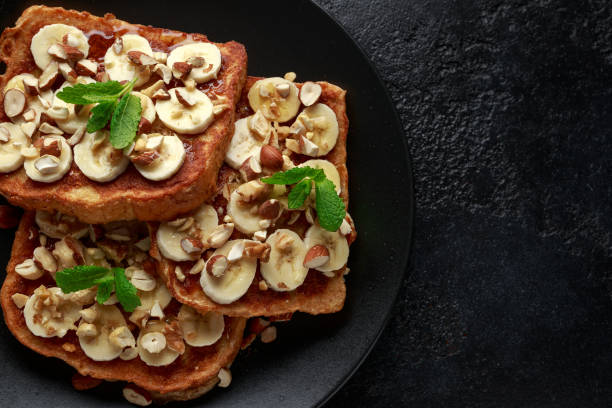 istock French cinnamon toast with banana, nuts and hazelnut, honey. 1139529072