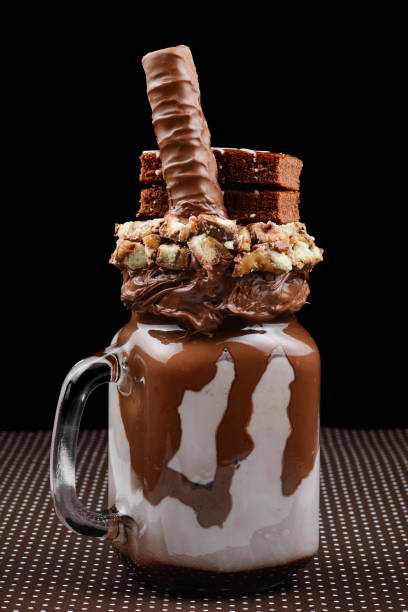 istock Chocolate extreme milkshake with brownie cake, chocolate paste and sweets. Crazy freakshake food trend. Copy space 1139530277