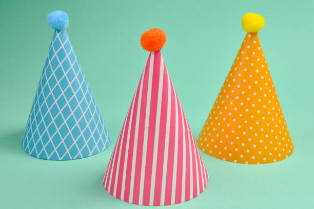 istock Colorful birthday cap on a green background. 1139530350