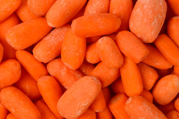 istock Little fresh carrots as a background. Snack. 1139530371