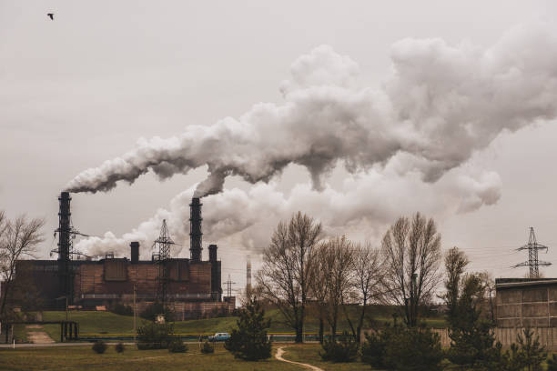 istock mining enterprise with smoke stacks. Dirty smoke on the sky, ecology problems. 1139530387