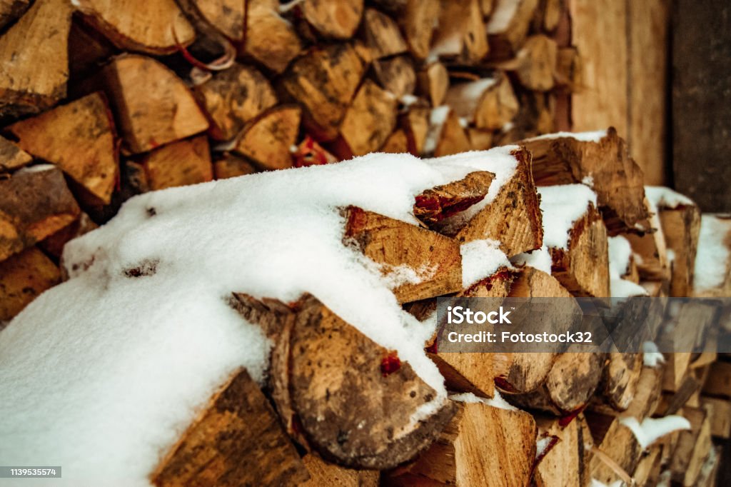 Firewood for the winter. Firewood for the winter. The house will be warm and cozy. Fire the stove with wood. Abstract Stock Photo