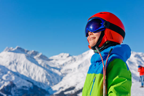 istock Cute skier boy in a winter ski resort. 1139535824