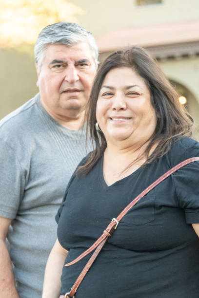istock Smiling mature senior couple posing looking at the camera 1139538017