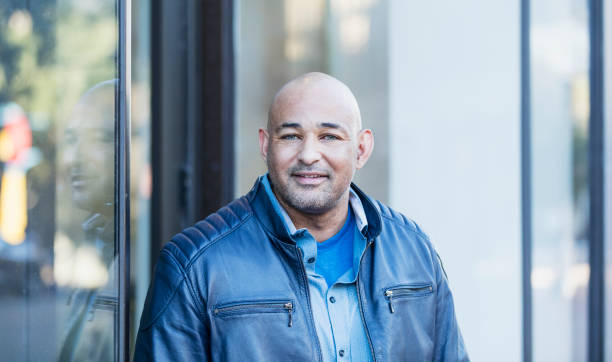 istock Mature Hispanic man standing outside building 1139539581