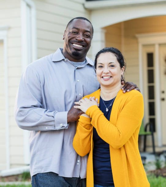 istock Happy interracial couple outside house 1139540646