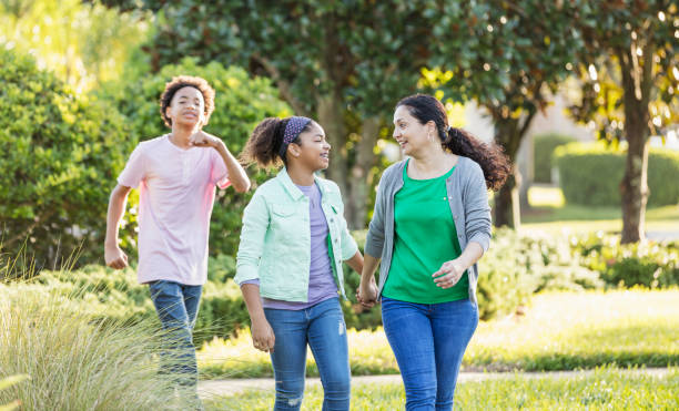 istock Mixed race children and mother taking a walk 1139540742