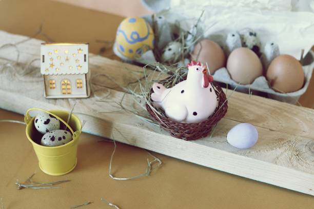 istock Eggs, toy chicken, toy house with illumination, Easter decor 1139541478