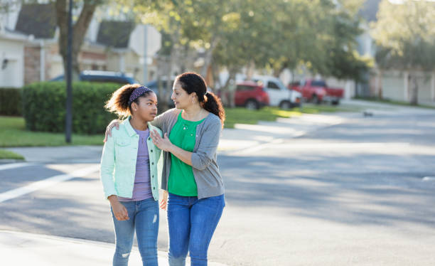 istock Mother and daughter walking together, talking 1139541505