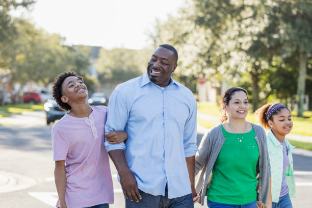 istock Interracial family, two children, taking walk together 1139541577
