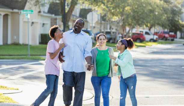 istock Interracial family, two children, taking walk together 1139541650