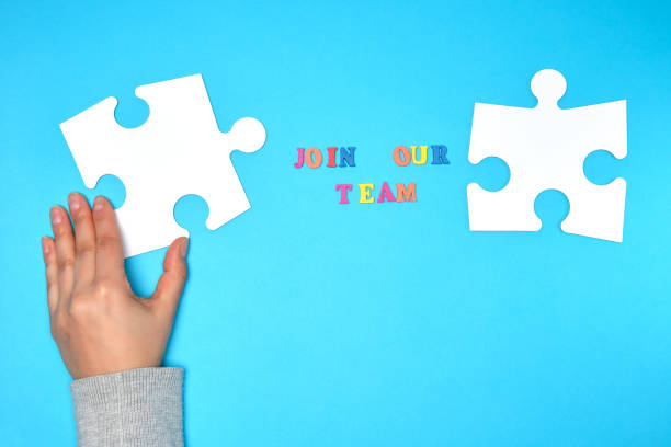 istock women's hand hold  large white puzzle 1139541829