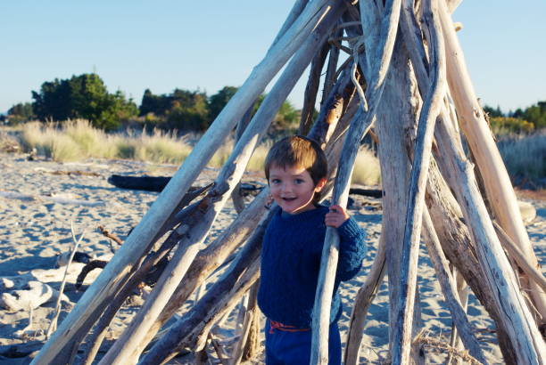 istock Young Boy Playing at Estuary in Winter 1139542569