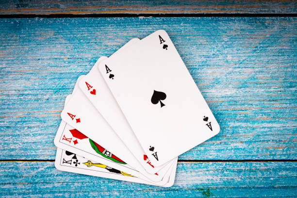 istock Poker cards on old background 1139543176