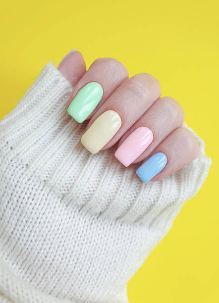 istock female hand colored manicure sweater 1139543978