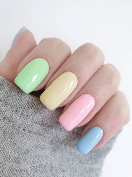 istock female hand colored manicure sweater 1139545229