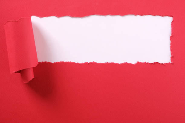 istock Torn red paper strip banner white background 1139547652