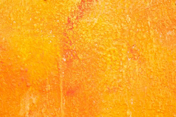 Photo of orange painting on the wall texture