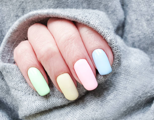 istock female hand colored manicure sweater 1139547966