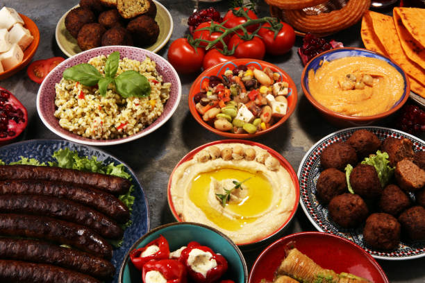Middle eastern or arabic dishes and assorted meze, concrete rustic background. Falafel. Turkish Dessert Baklava with pistachio. Halal food. Lebanese cuisine