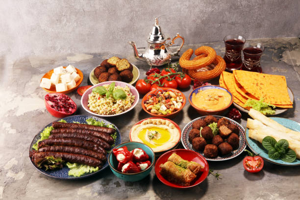 istock Middle eastern or arabic dishes and assorted meze, concrete rustic background. Falafel. Turkish Dessert Baklava with pistachio. Halal food. Lebanese cuisine 1139548884