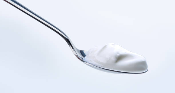 istock Greek yoghurt on silver spoon 1139549654