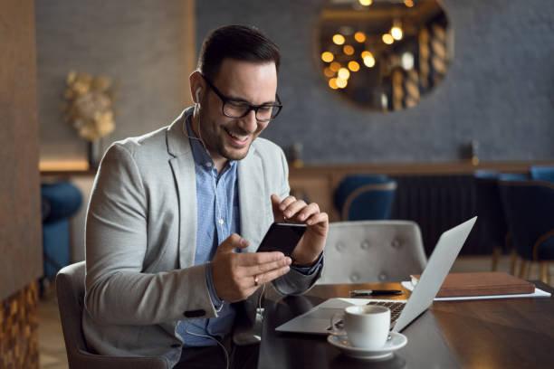 istock Businessman using mobile phone in cafe 1139550792