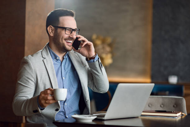 istock Smiling  businessman talking on a mobile phone 1139550990