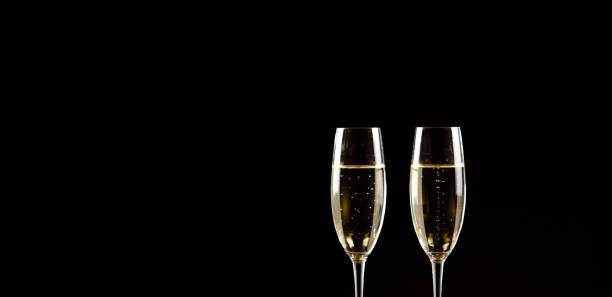 istock Champagne glasses on black background. Holiday celebration concept. 1139556196