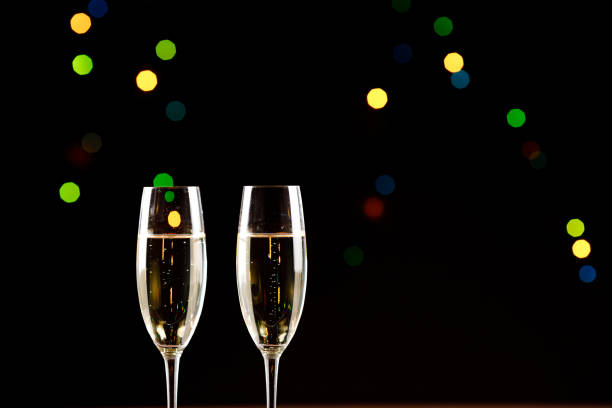istock Champagne glasses on black background. Holiday celebration concept. 1139556205